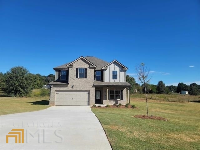 120 Massey Lane Locust Grove, GA 30248 - Photo 1 of 1 a front view of a house with a yard