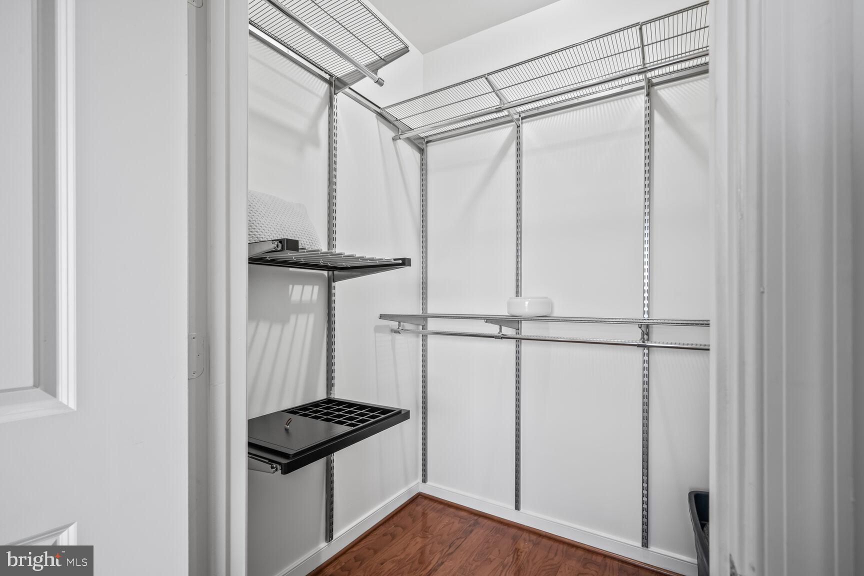 8045 Newell Street, Unit 516 Silver Spring, MD 20910 - Photo 19 of 33 a view of a storage & utility room with wooden floor