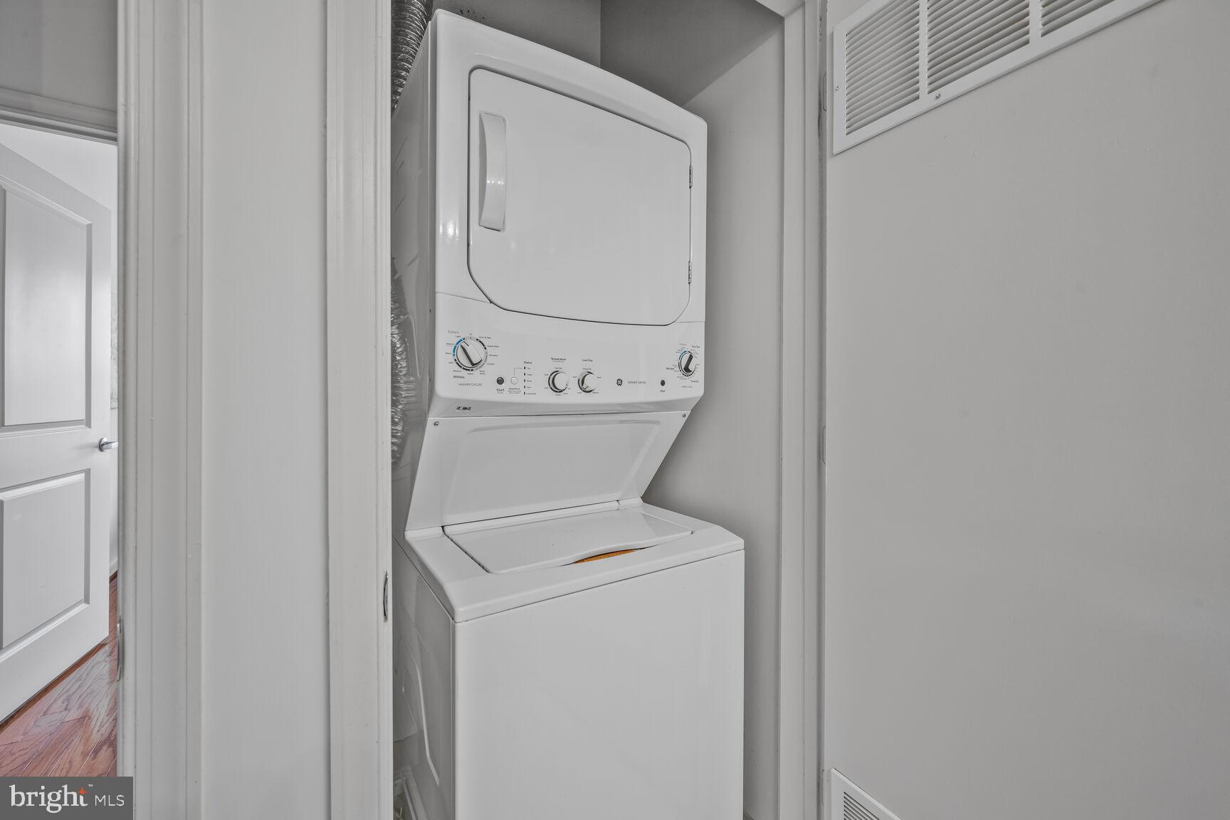 8045 Newell Street, Unit 516 Silver Spring, MD 20910 - Photo 23 of 33 a utility room with dryer and washer