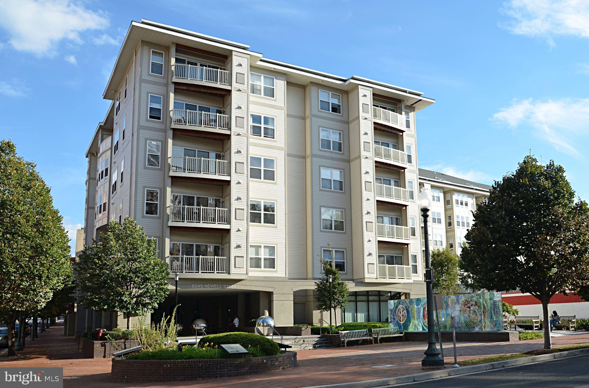 8045 Newell Street, Unit 516 Silver Spring, MD 20910 - Photo 32 of 33 a front view of a building with street view