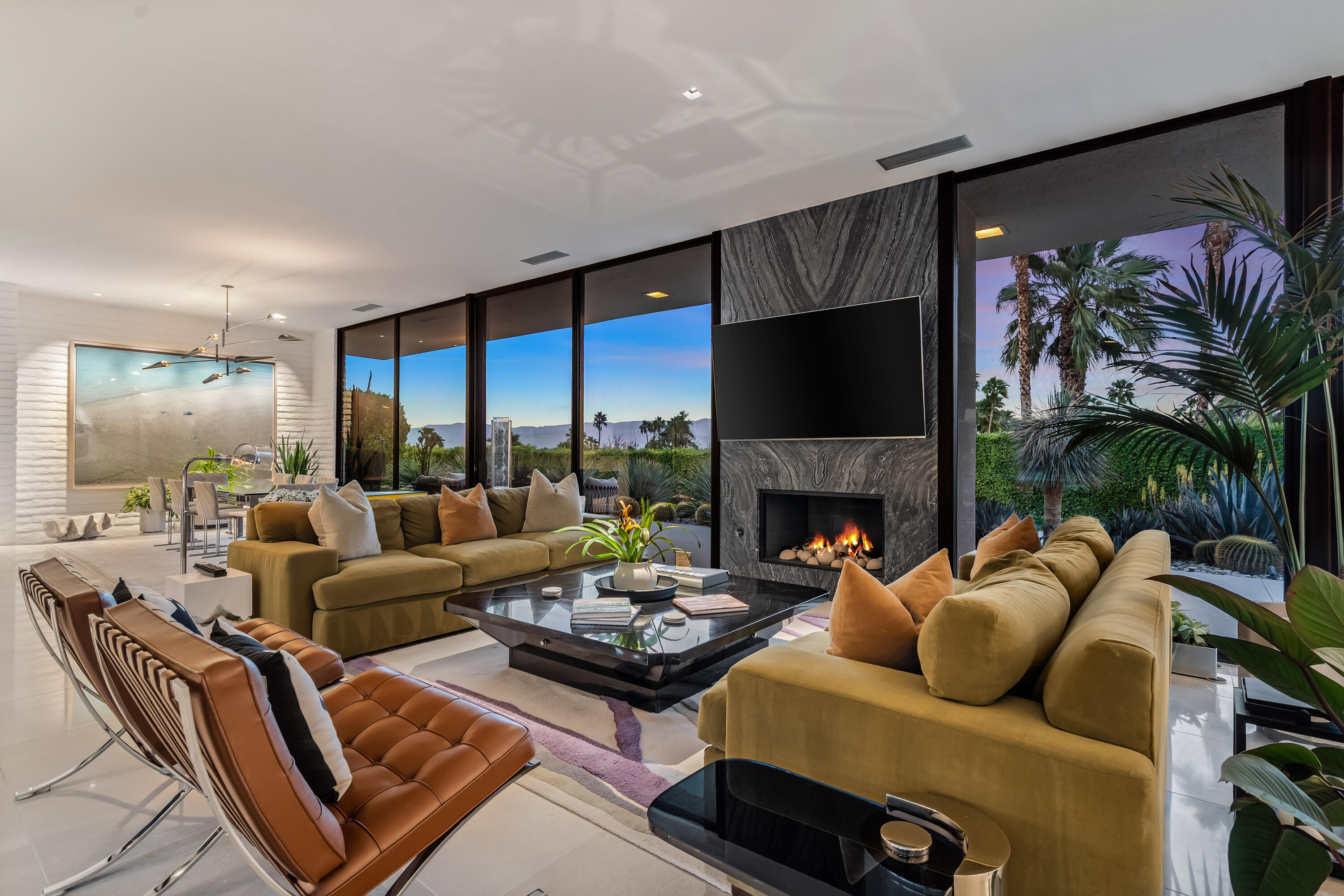 70149 Sonora Road Rancho Mirage, CA 92270 - Photo 14 of 48 a living room with furniture fireplace and a large window