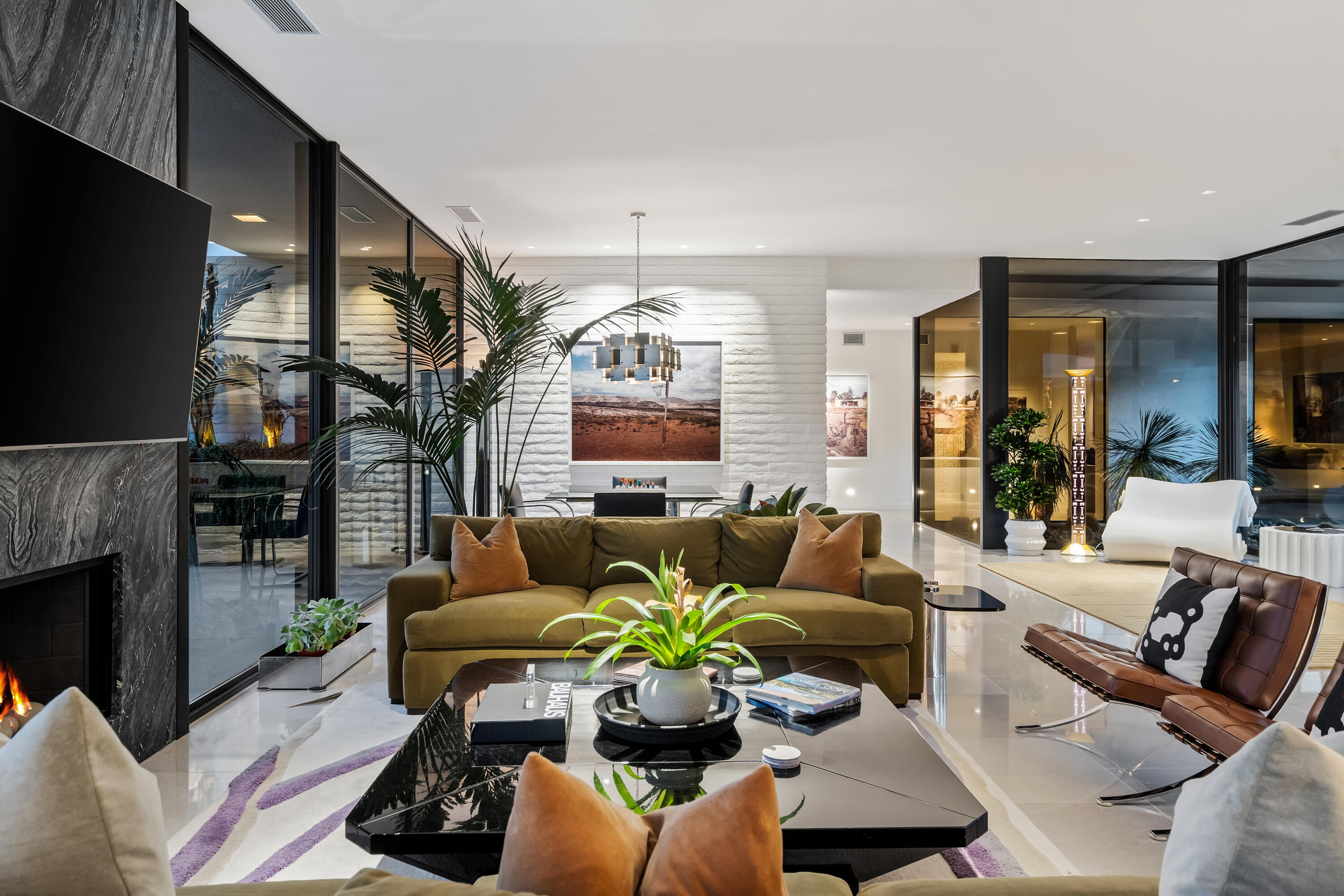 70149 Sonora Road Rancho Mirage, CA 92270 - Photo 15 of 48 a living room with furniture fireplace and a flat screen tv