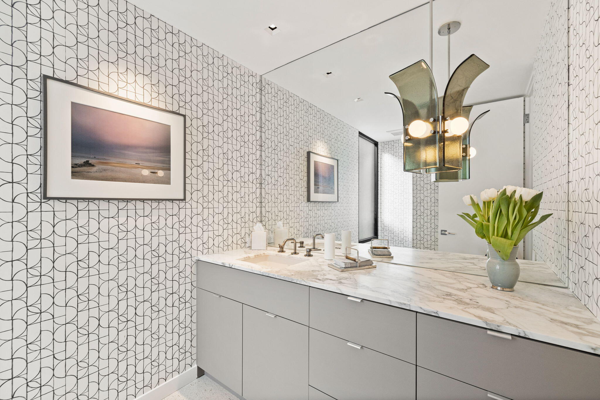 70149 Sonora Road Rancho Mirage, CA 92270 - Photo 29 of 48 a bathroom with a sink a mirror and a potted plant