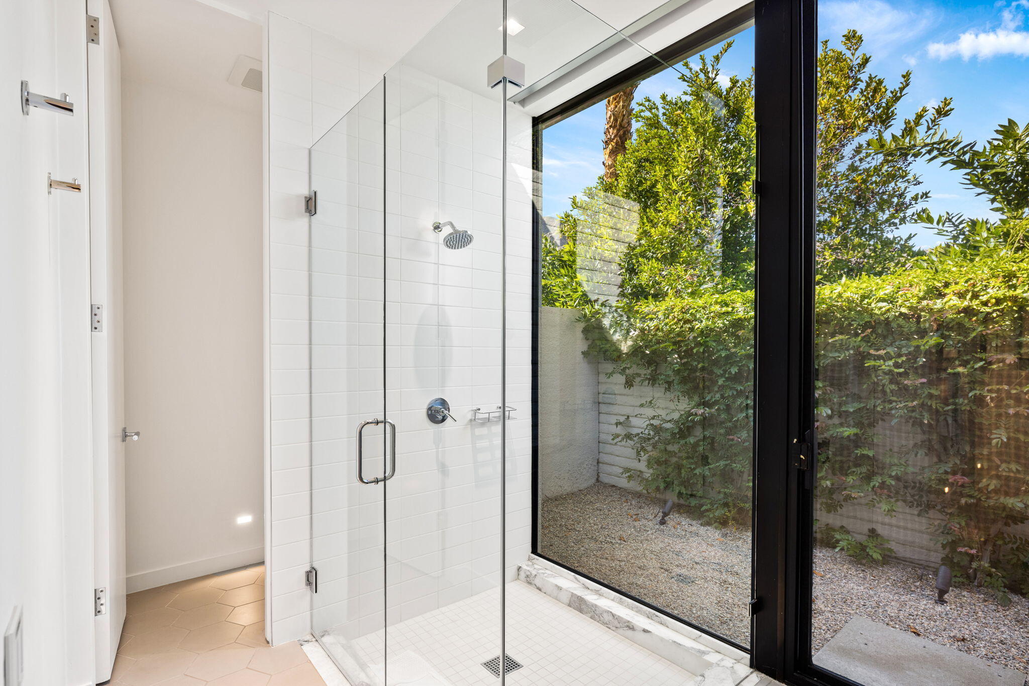 70149 Sonora Road Rancho Mirage, CA 92270 - Photo 33 of 48 a bathroom with a glass shower door