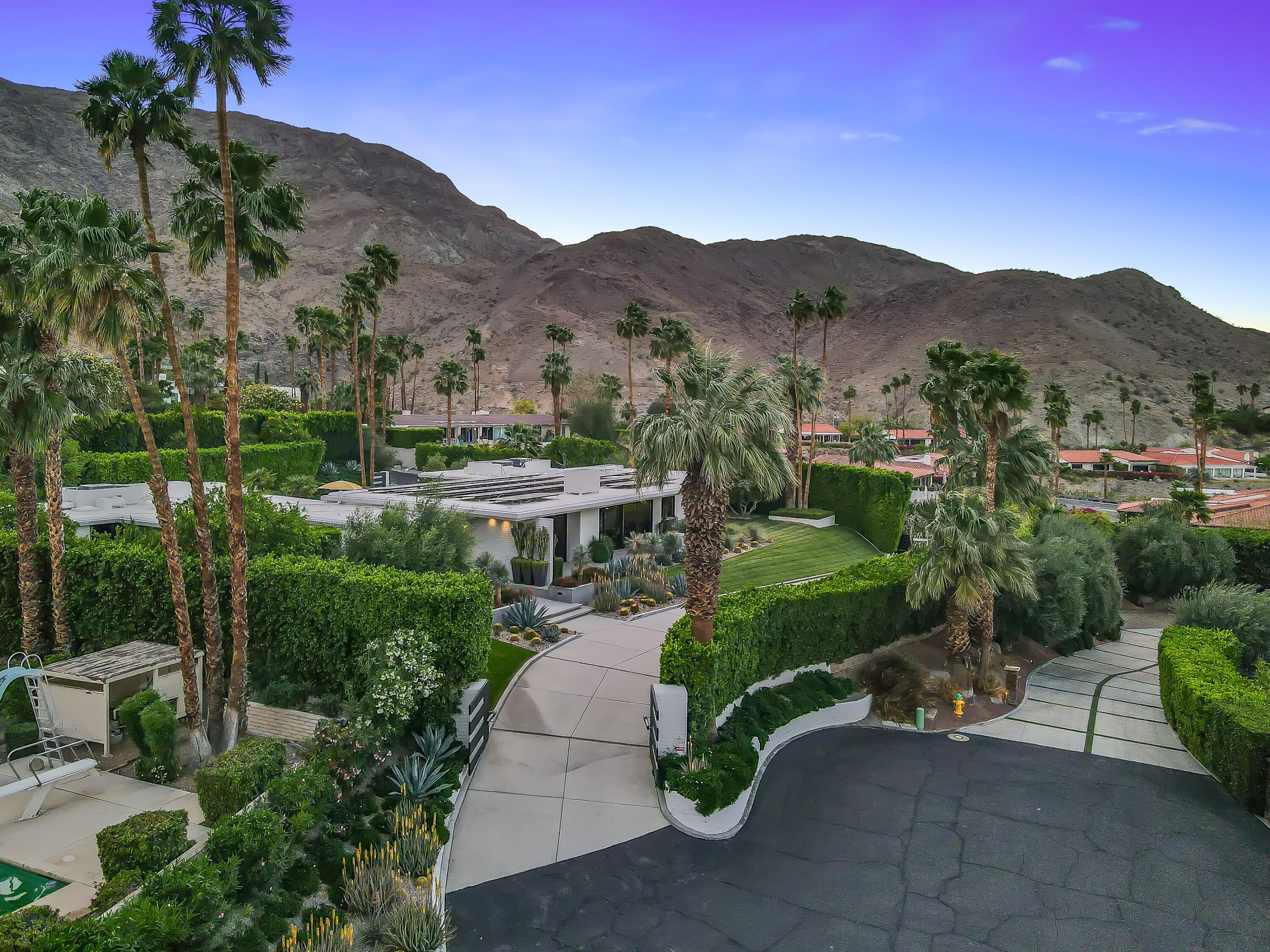 70149 Sonora Road Rancho Mirage, CA 92270 - Photo 36 of 48 a view of a patio with a table and chairs and a fire pit