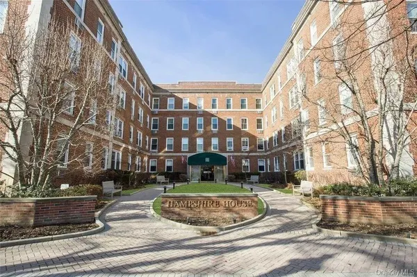 a view of a building with a yard