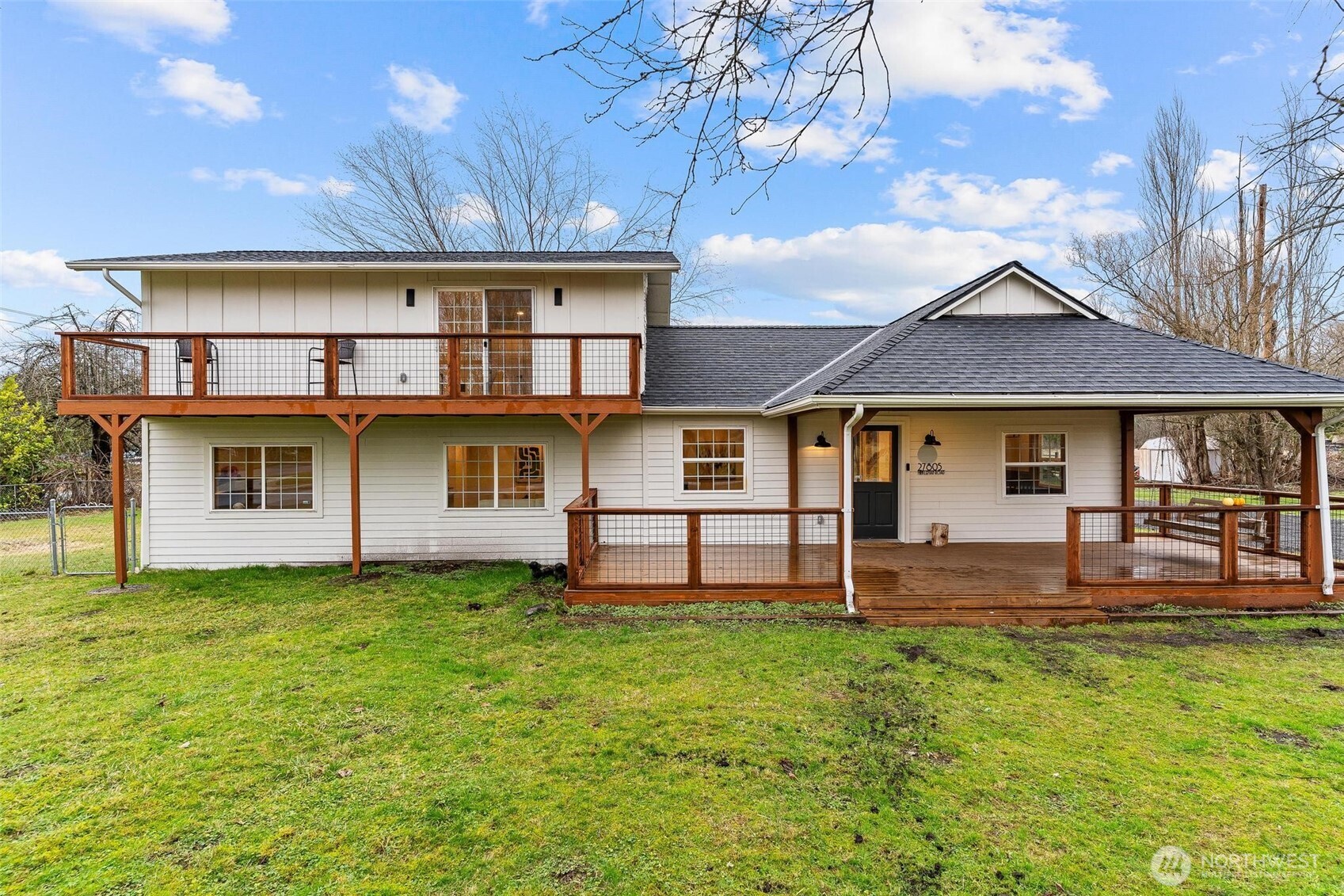 a front view of a house with a yard