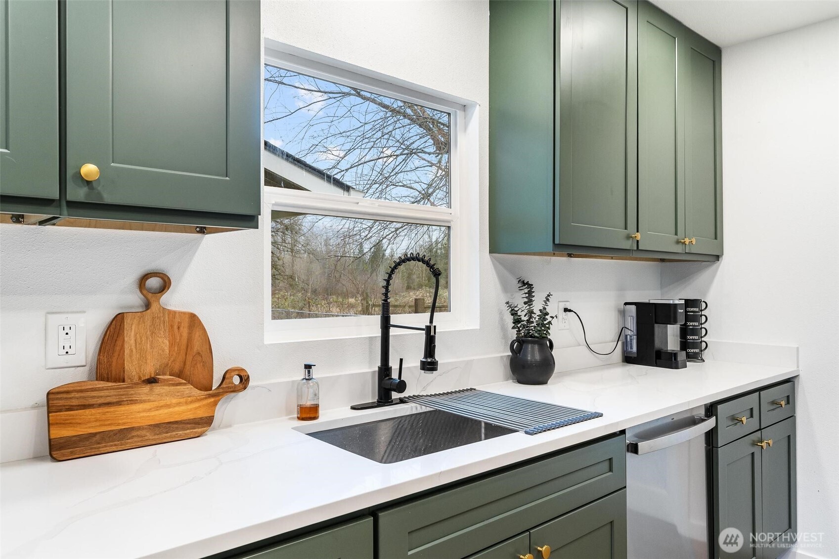 27805 Hinkleman Road East Buckley, WA 98321 - Photo 11 of 40 a kitchen with a sink and cabinets