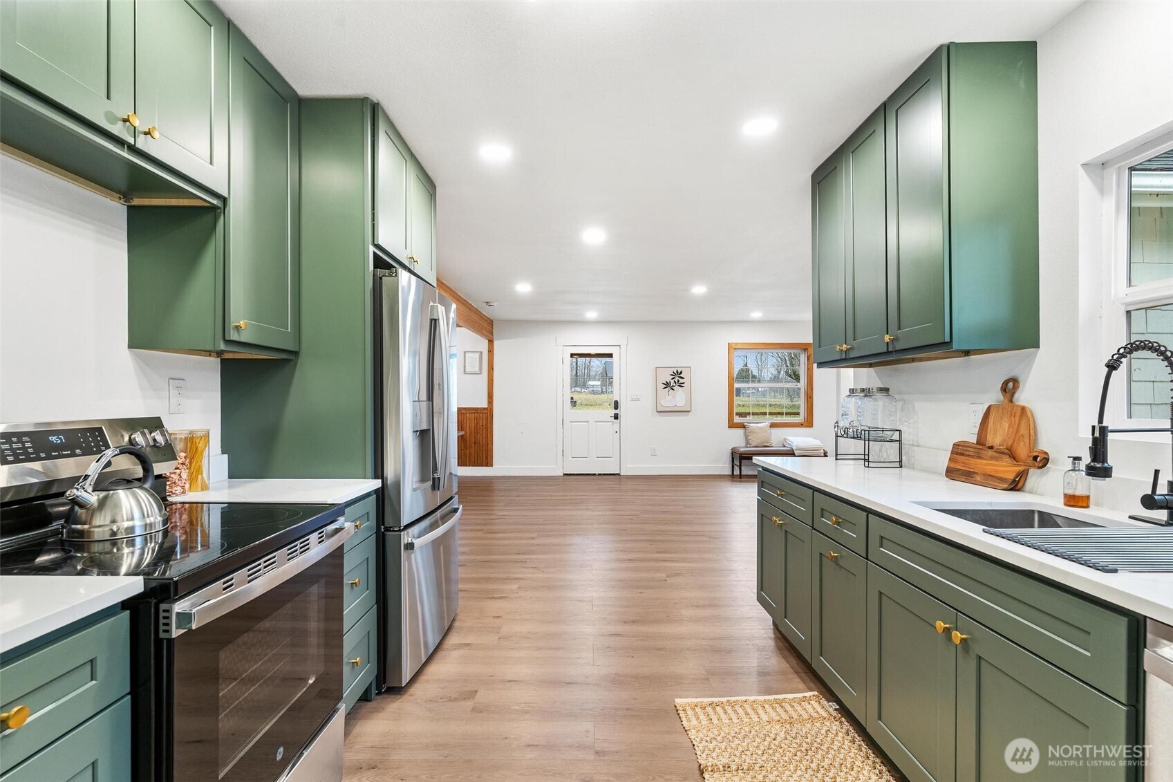 27805 Hinkleman Road East Buckley, WA 98321 - Photo 14 of 40 a kitchen with stainless steel appliances granite countertop a sink stove and cabinets