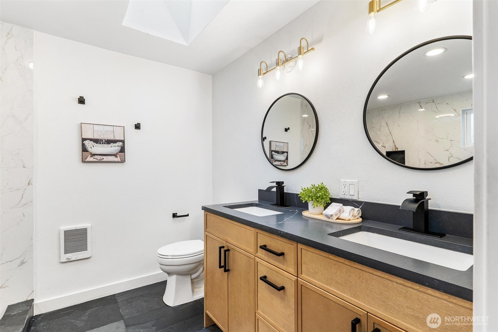 27805 Hinkleman Road East Buckley, WA 98321 - Photo 25 of 40 a bathroom with a toilet a double vanity sink and a mirror