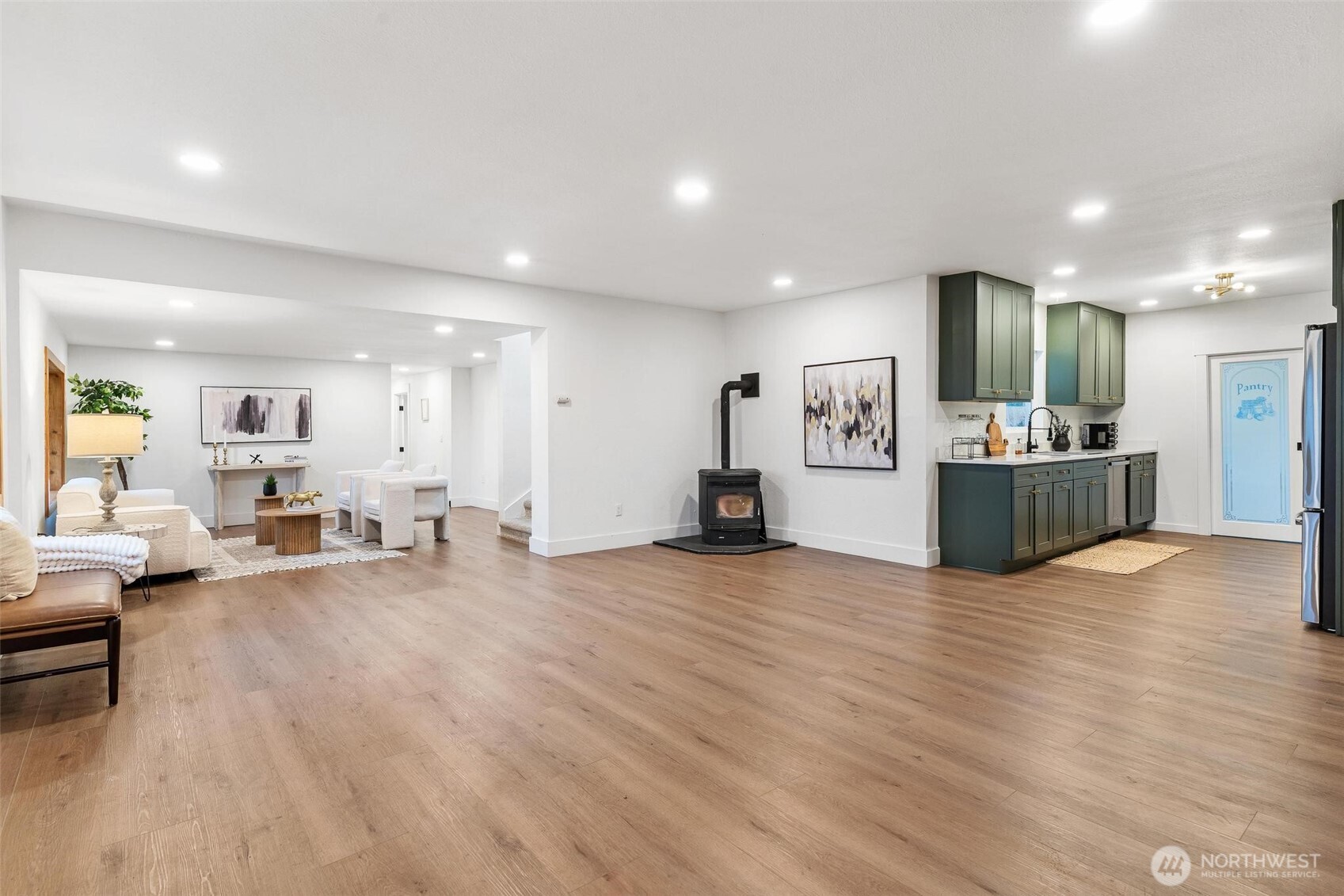 27805 Hinkleman Road East Buckley, WA 98321 - Photo 4 of 40 a view of a living room kitchen with furniture and wooden floor