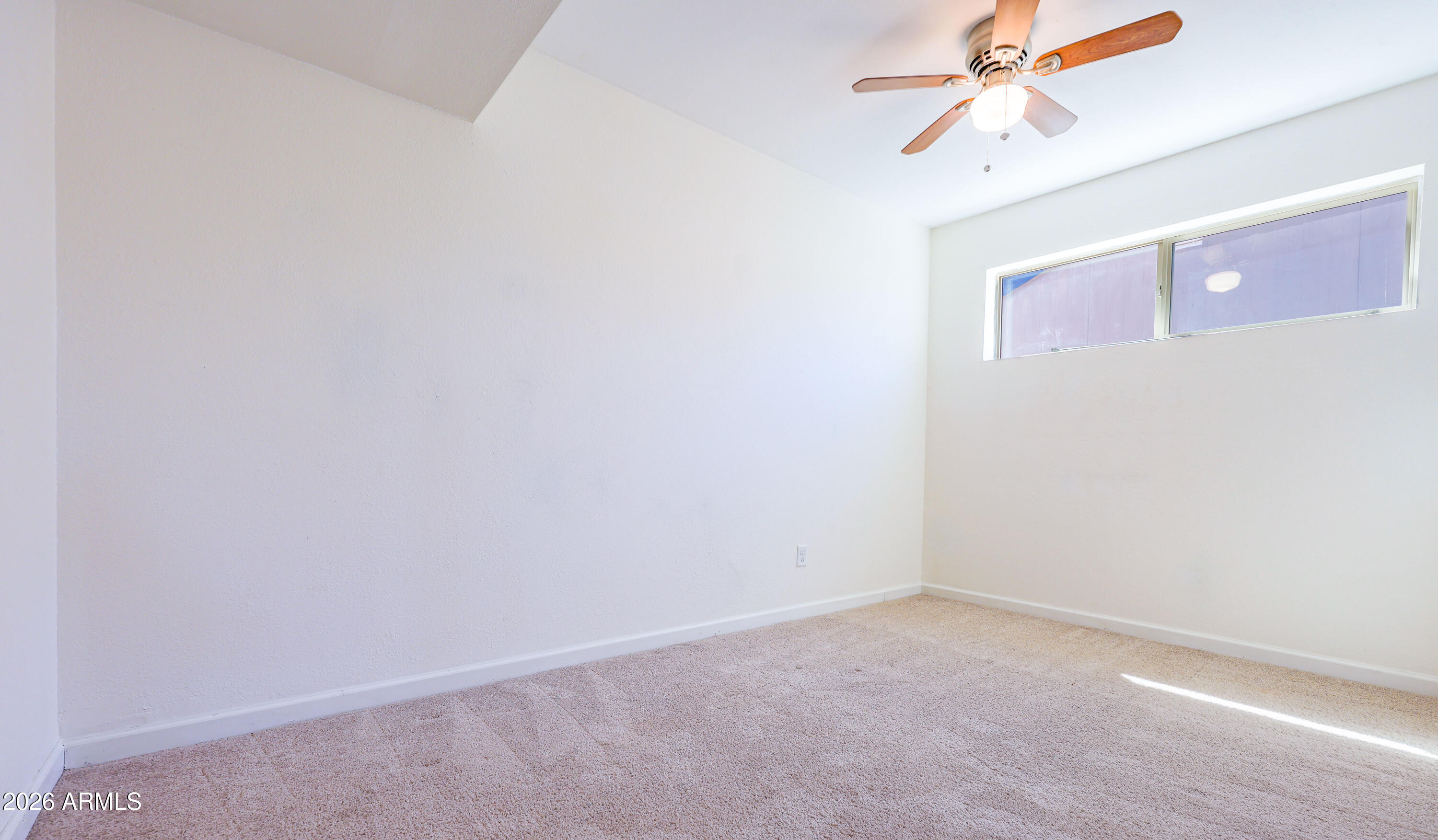 520 South 3rd Street Sierra Vista, AZ 85635 - Photo 12 of 28 an empty room with a window and a fan