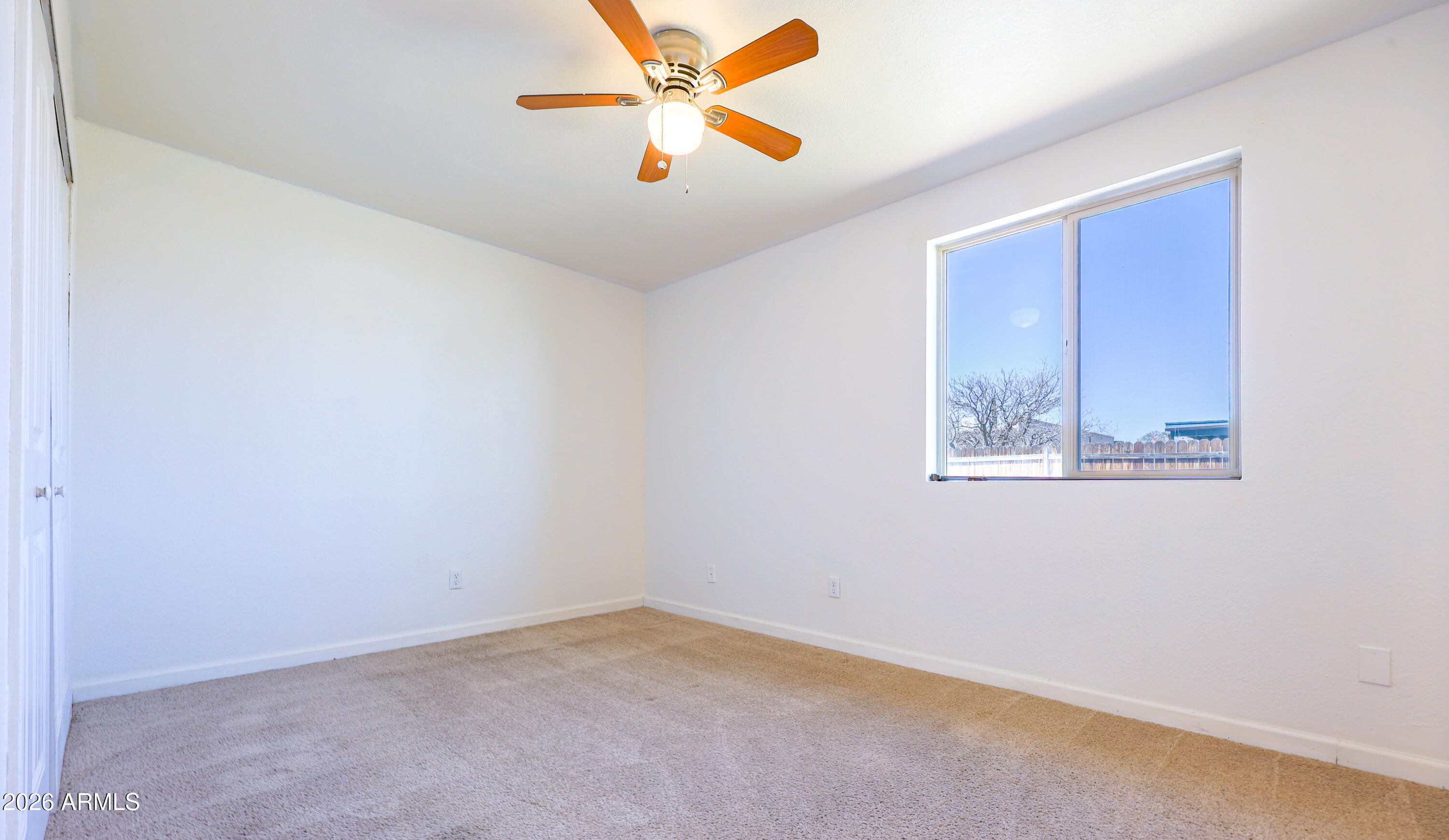 520 South 3rd Street Sierra Vista, AZ 85635 - Photo 17 of 28 an empty room with a window and a fan