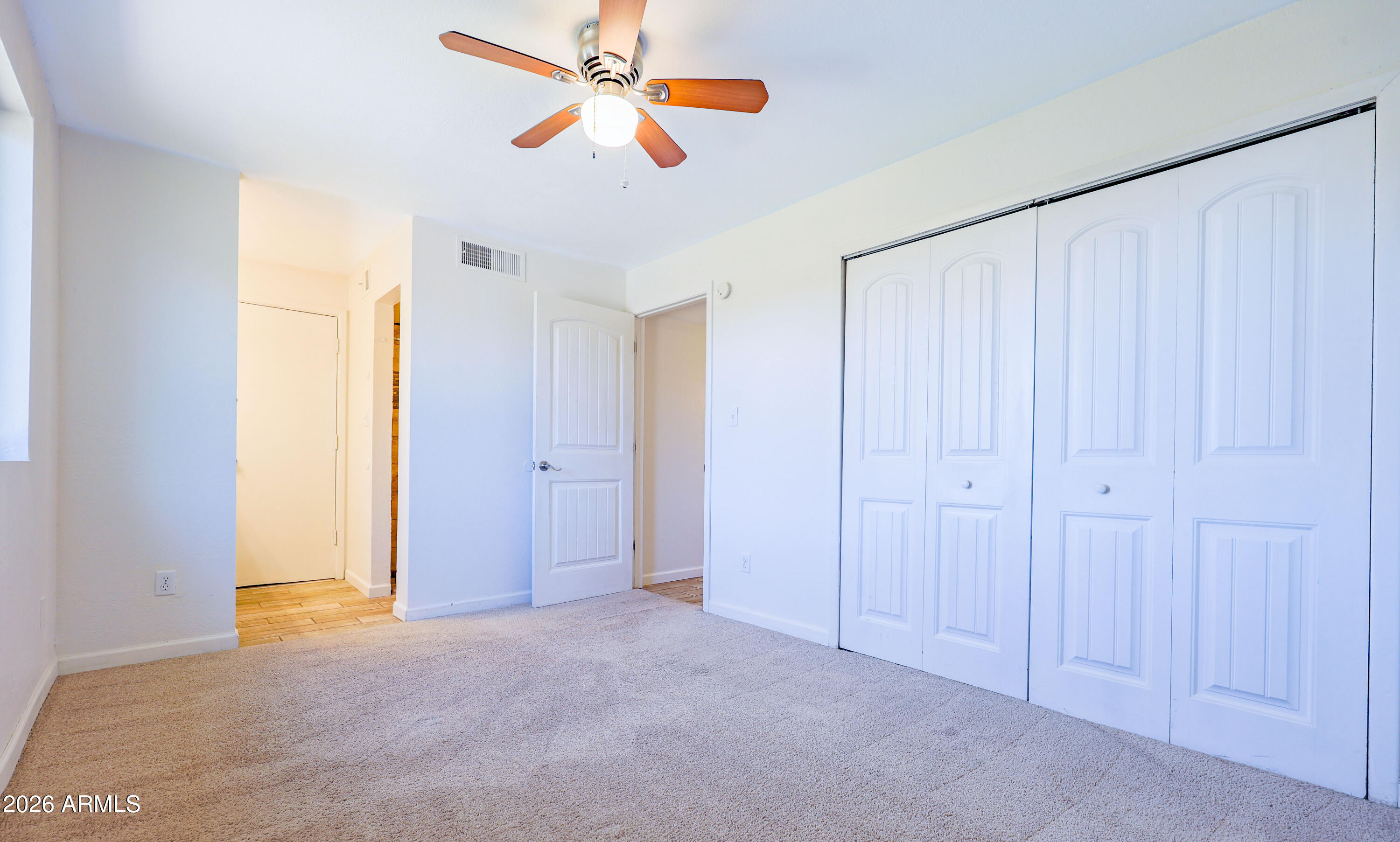 520 South 3rd Street Sierra Vista, AZ 85635 - Photo 18 of 28 a view of a room with a ceiling fan and a window