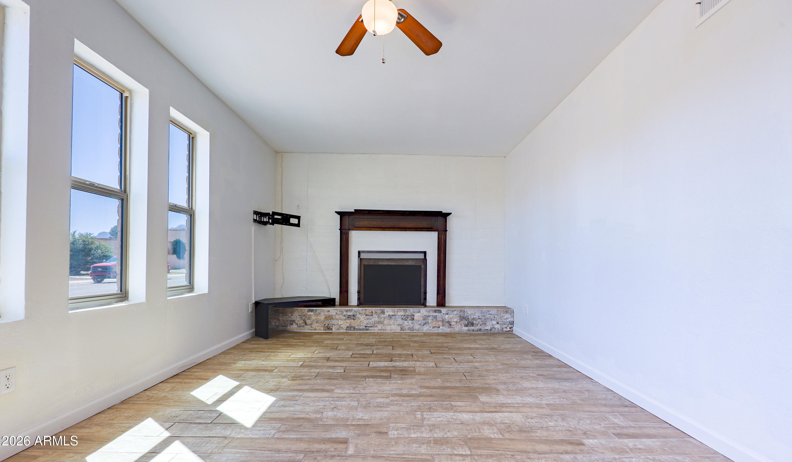 520 South 3rd Street Sierra Vista, AZ 85635 - Photo 4 of 28 a view of a livingroom with wooden floor and a window