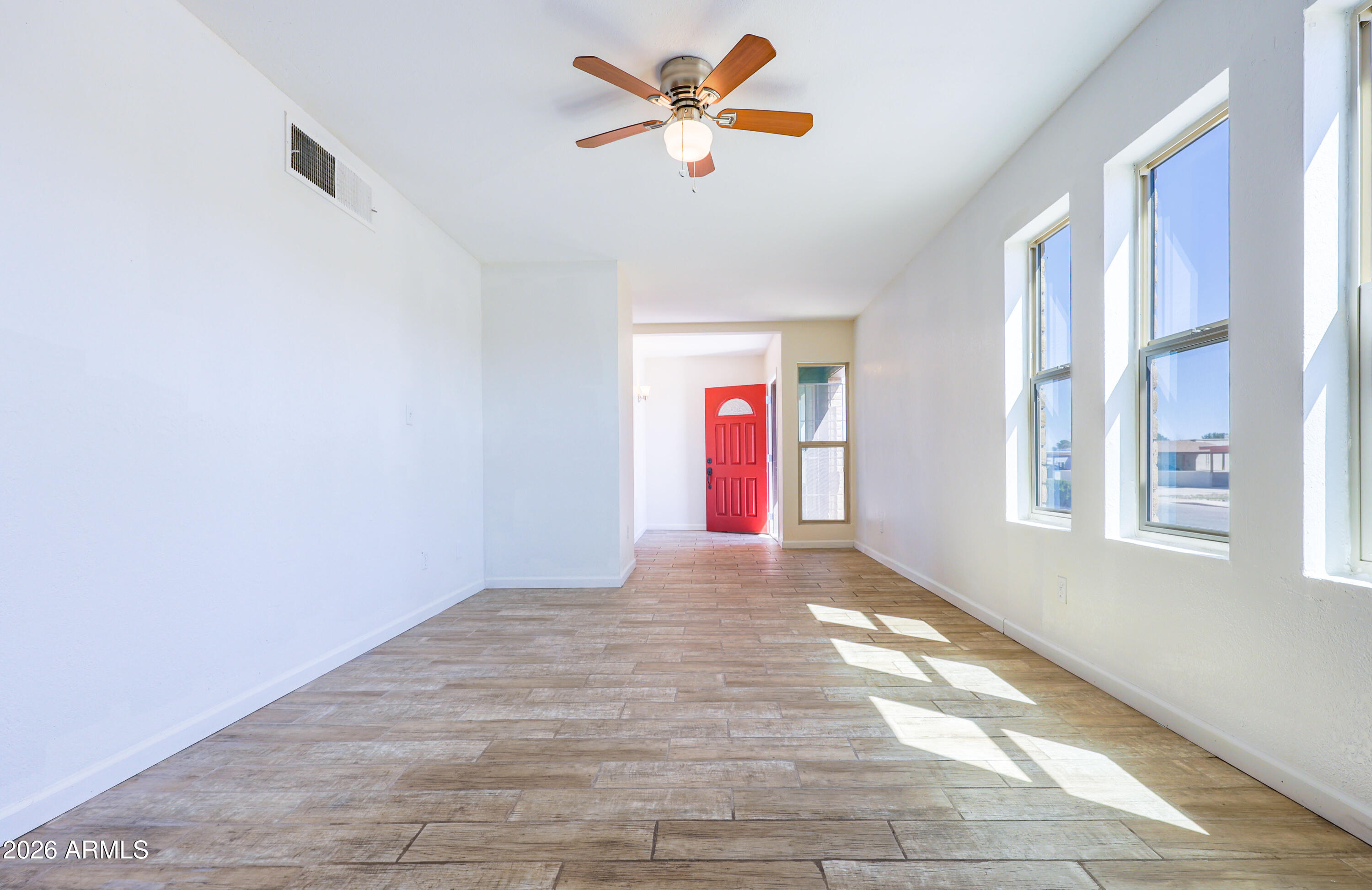 520 South 3rd Street Sierra Vista, AZ 85635 - Photo 5 of 28 a view of an empty room with window and a kitchen view