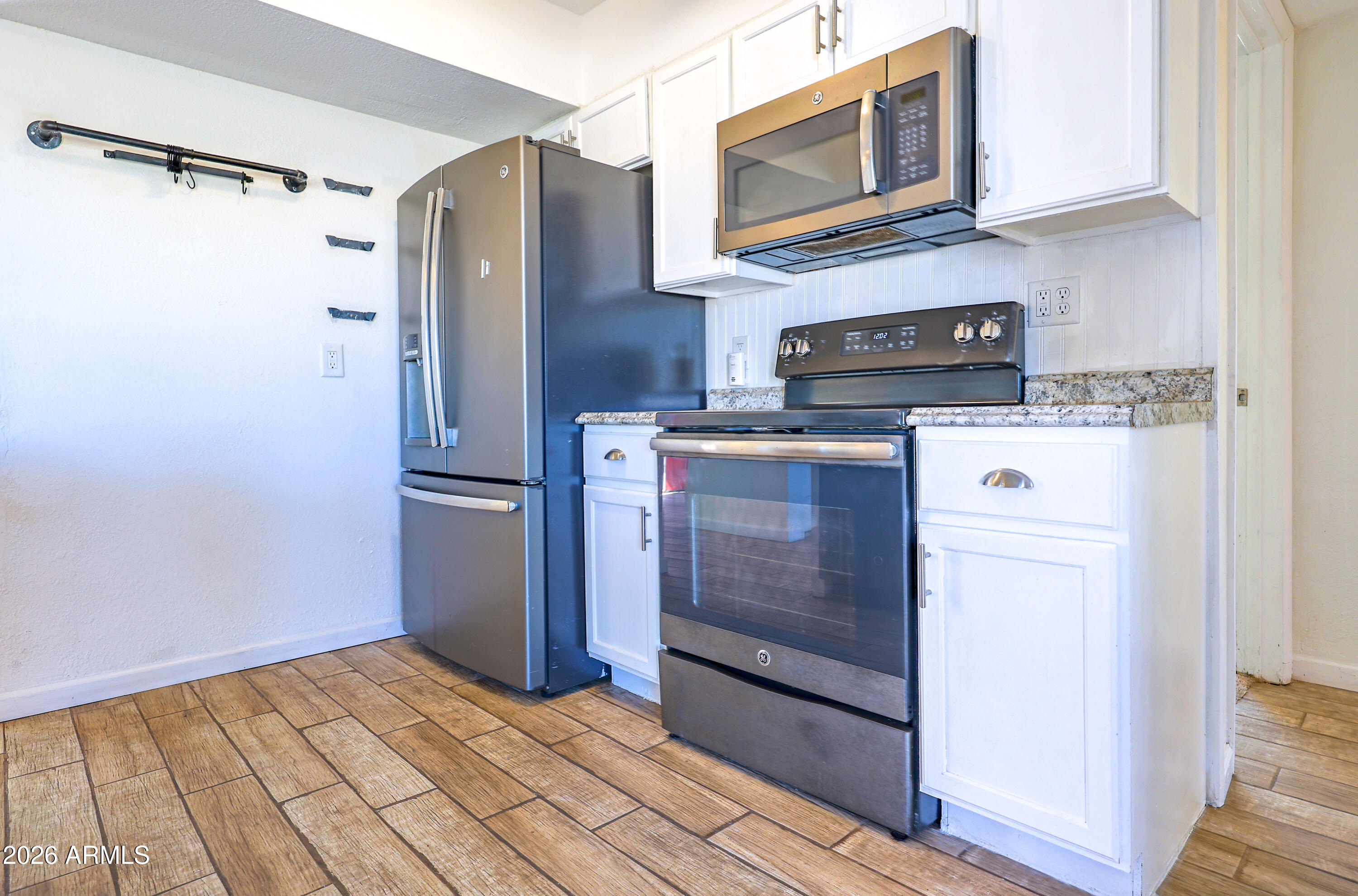 520 South 3rd Street Sierra Vista, AZ 85635 - Photo 8 of 28 a kitchen with stainless steel appliances a refrigerator stove and microwave