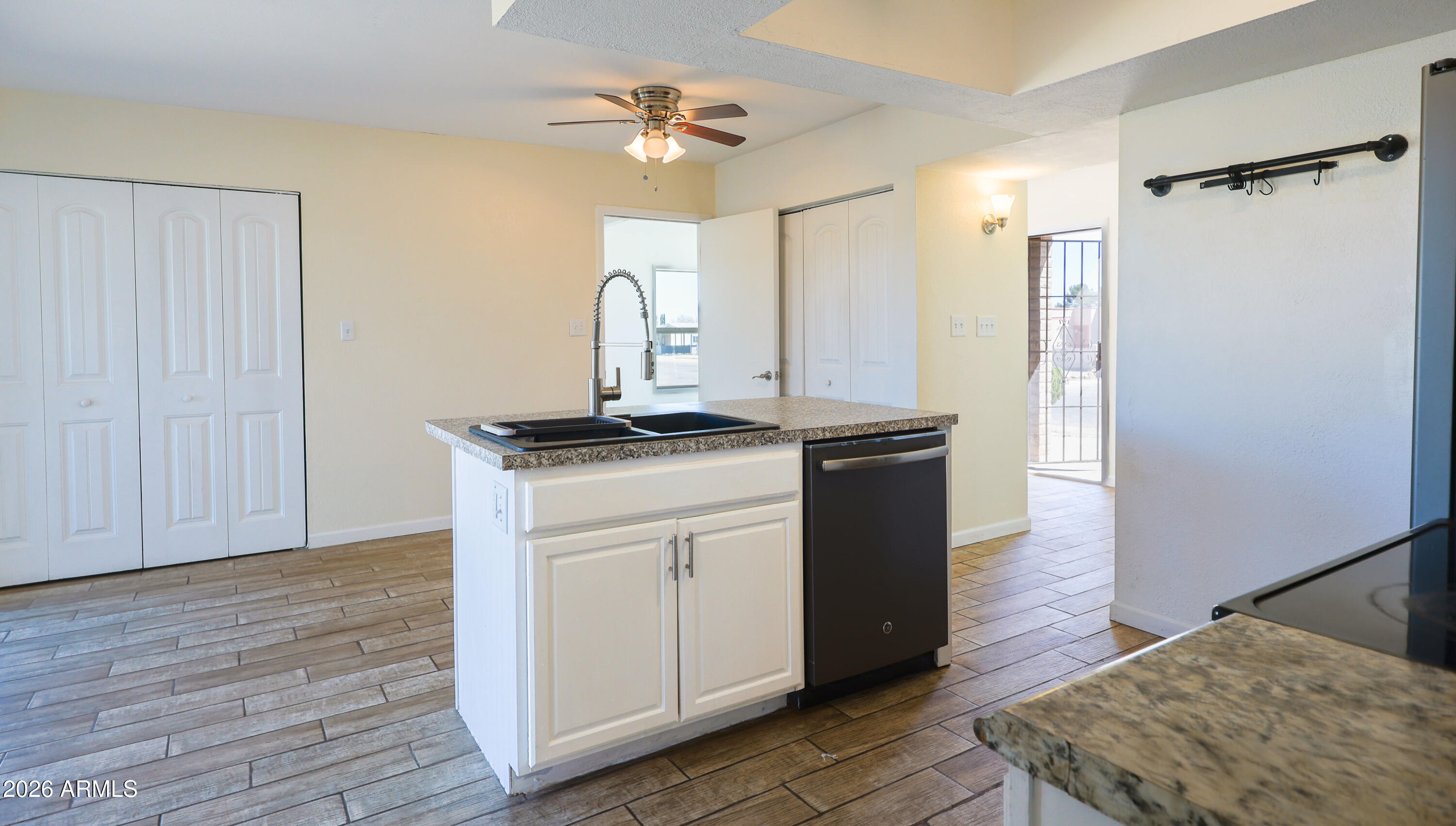 520 South 3rd Street Sierra Vista, AZ 85635 - Photo 9 of 28 a kitchen with stainless steel appliances granite countertop a sink stove and refrigerator