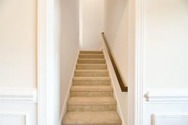 a view of staircase with white walls