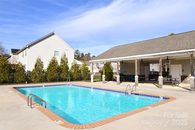 a view of a swimming pool with a patio