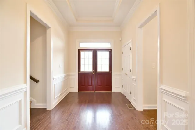 a view of entryway with wooden floor