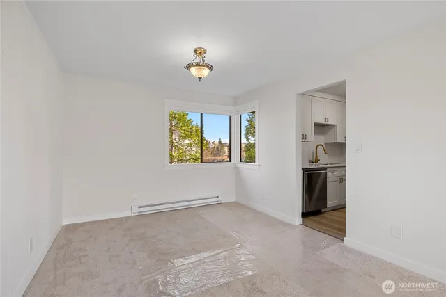 a view of an empty room with a window