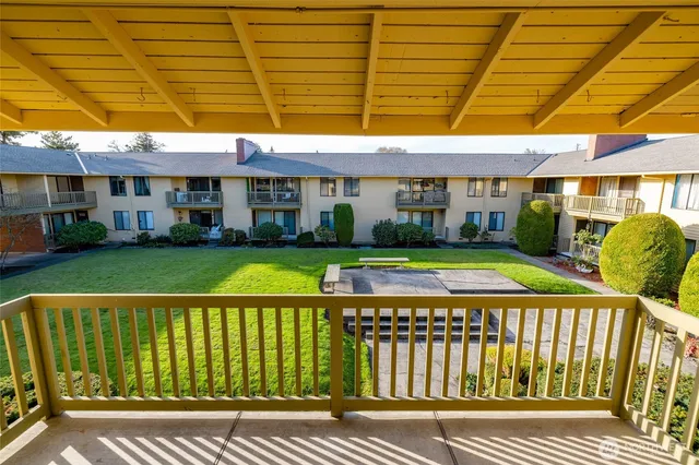 a view of a building with a yard