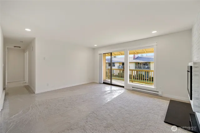 an empty room with windows and view