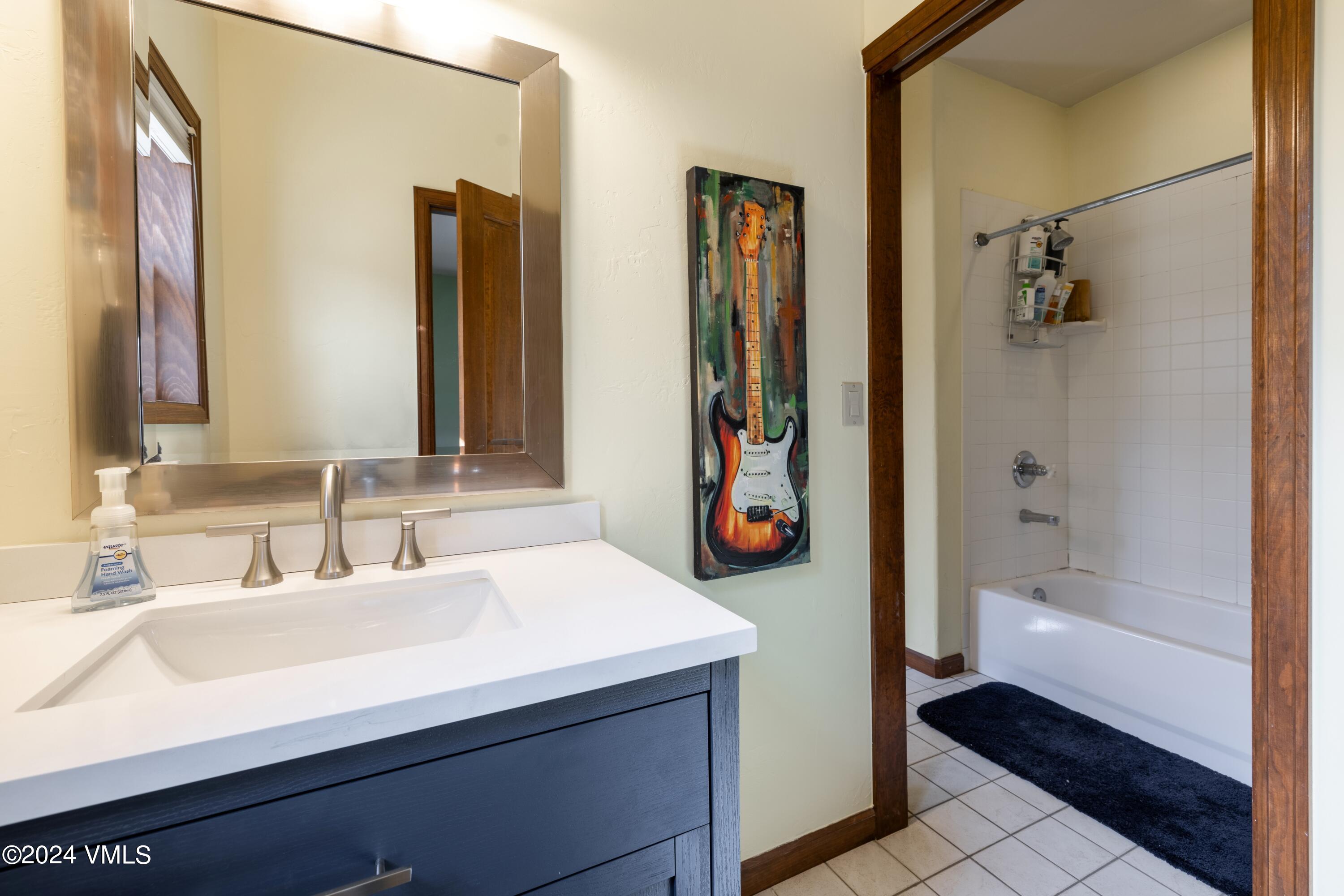 46 Andover Trail, Unit A Edwards, CO 81632 - Photo 17 of 27 a bathroom with a sink and a mirror