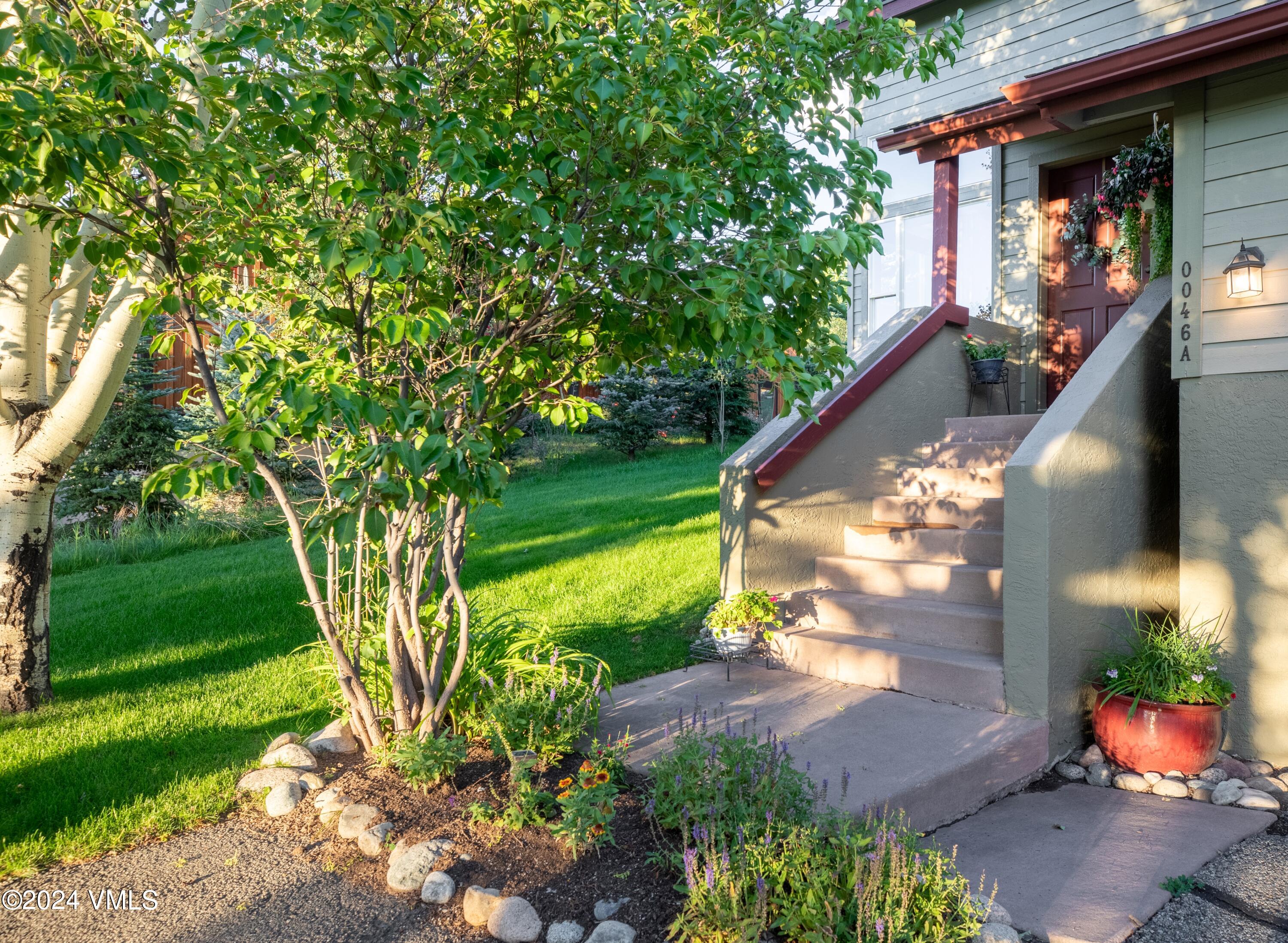 46 Andover Trail, Unit A Edwards, CO 81632 - Photo 19 of 27 a front view of a house with garden