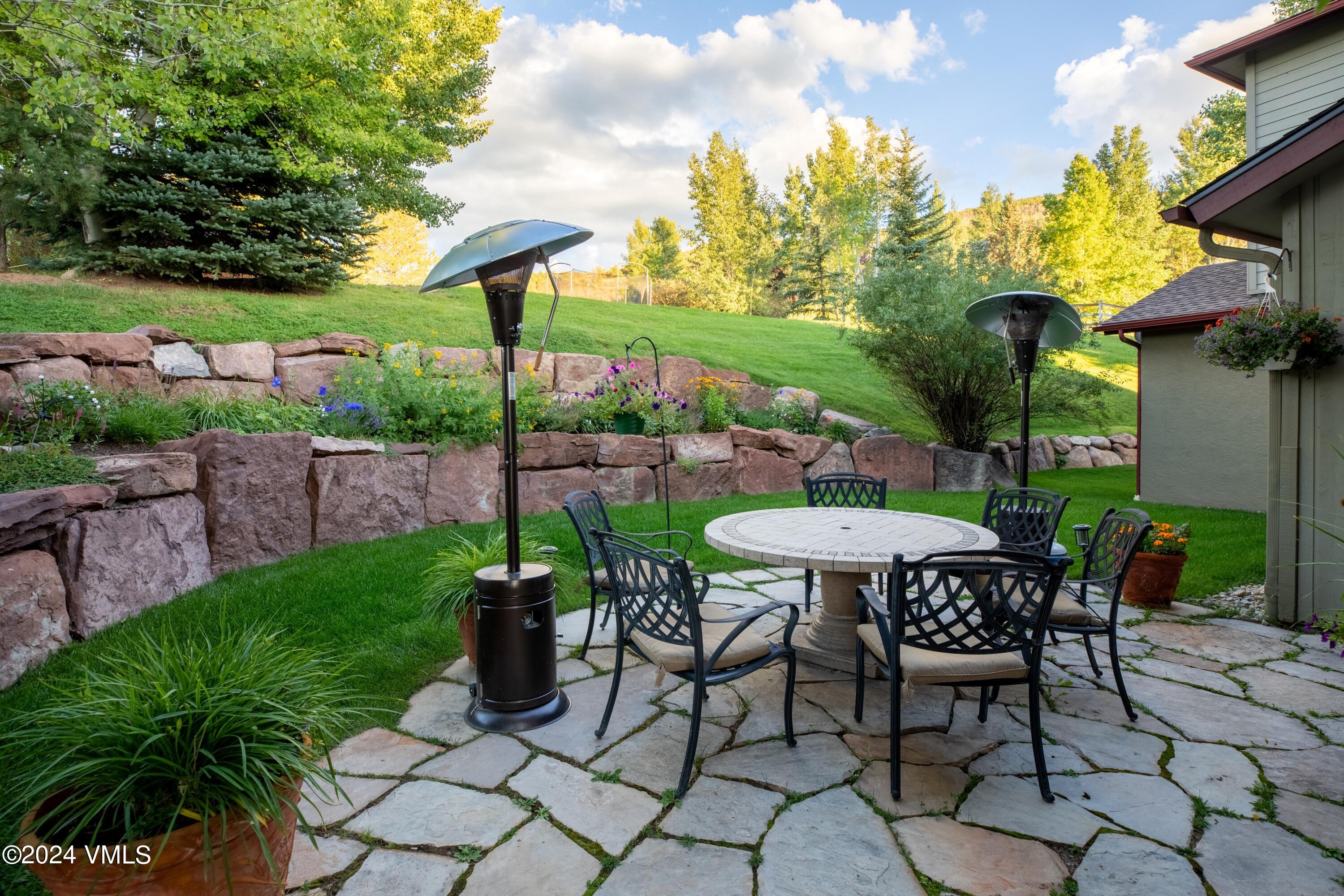 46 Andover Trail, Unit A Edwards, CO 81632 - Photo 23 of 27 a view of a table and chairs in backyard under a small yard
