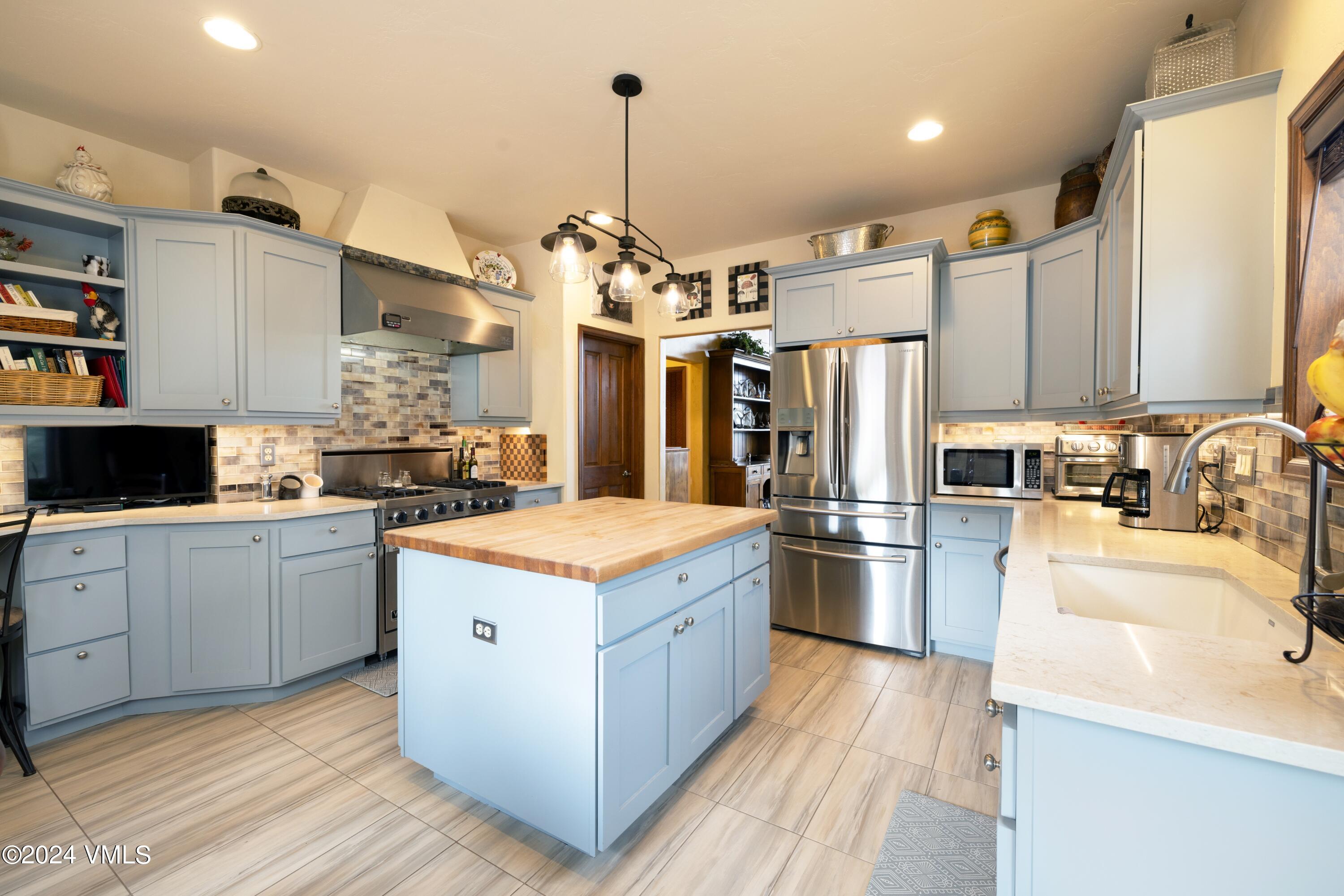 46 Andover Trail, Unit A Edwards, CO 81632 - Photo 5 of 27 a kitchen that has a lot of cabinets a sink and dishwasher