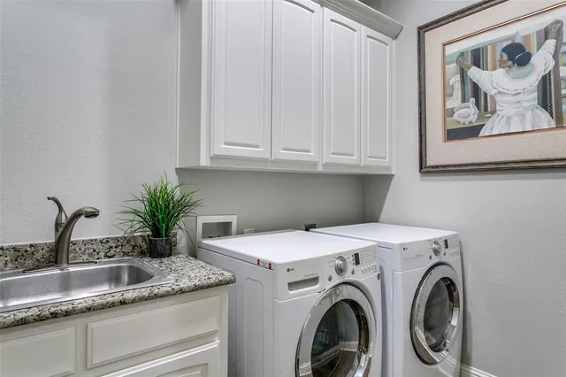 a view of kitchen sink and utility room