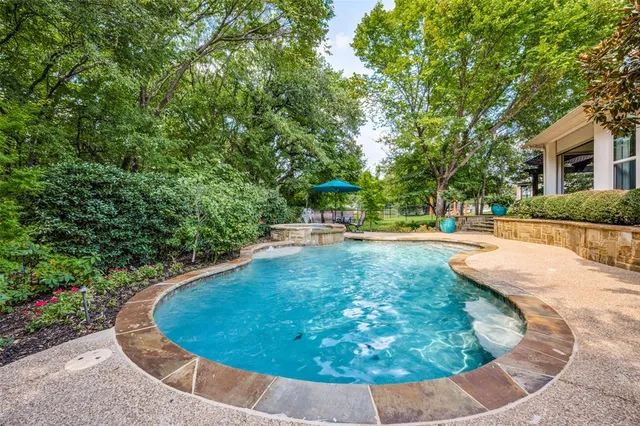 a view of a swimming pool with an outdoor space
