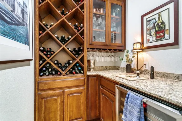 a kitchen with stainless steel appliances granite countertop a sink and a stove