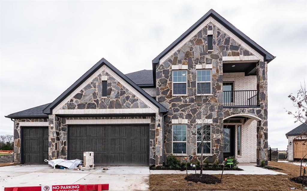 a front view of a building with parking