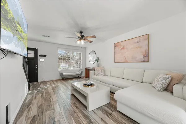 a living room with furniture and a window