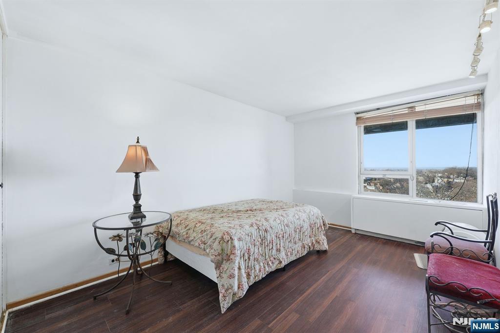 2 Horizon Road, Unit 1010 Fort Lee, NJ 07024 - Photo 16 of 42 a bedroom with a bed and a window