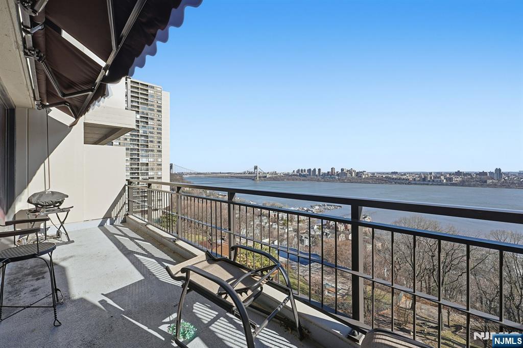 2 Horizon Road, Unit 1010 Fort Lee, NJ 07024 - Photo 24 of 42 a balcony with chairs