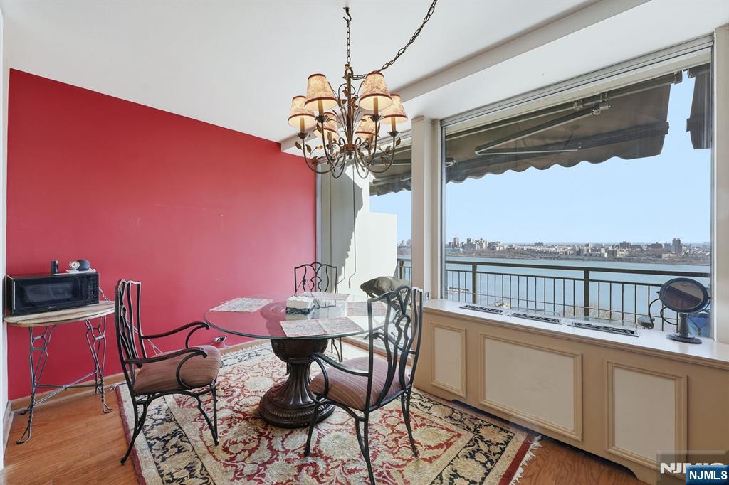 2 Horizon Road, Unit 1010 Fort Lee, NJ 07024 - Photo 6 of 42 a view of a dining room with furniture window and outside view