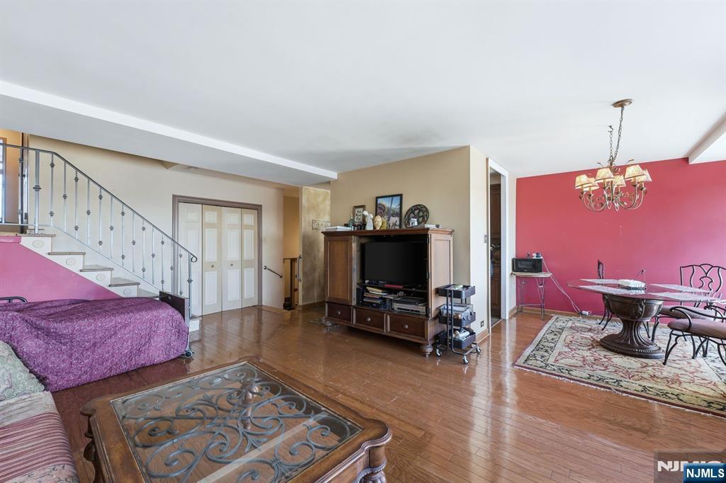 2 Horizon Road, Unit 1010 Fort Lee, NJ 07024 - Photo 8 of 42 a living room with furniture and a wooden floor