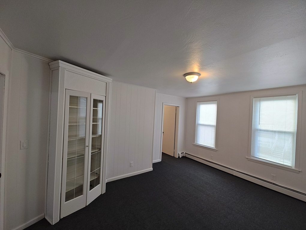 74 Linden Street, Unit 2 Holyoke, MA 01040 - Photo 13 of 20 a view of empty room with window