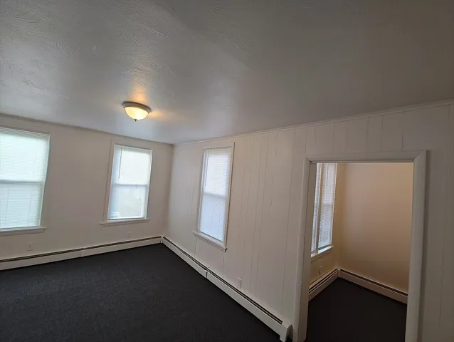a view of empty room with windows