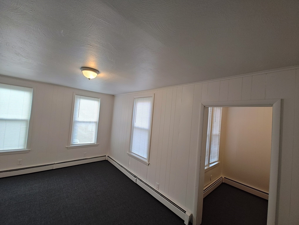 74 Linden Street, Unit 2 Holyoke, MA 01040 - Photo 14 of 20 an empty room with windows