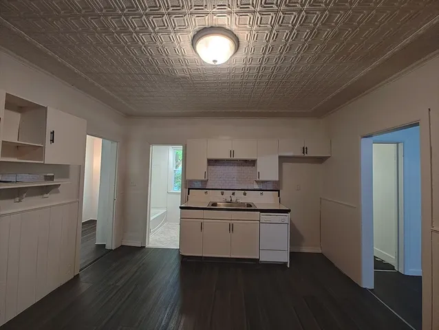 a kitchen with a sink and cabinets