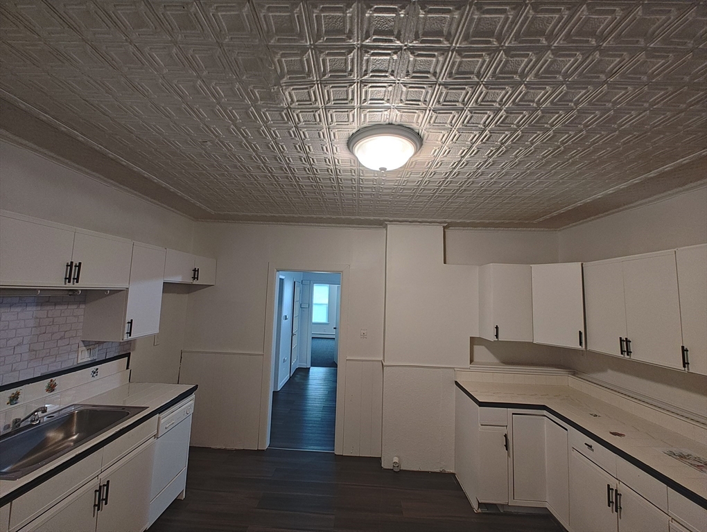 74 Linden Street, Unit 2 Holyoke, MA 01040 - Photo 6 of 20 a kitchen with a sink and cabinets