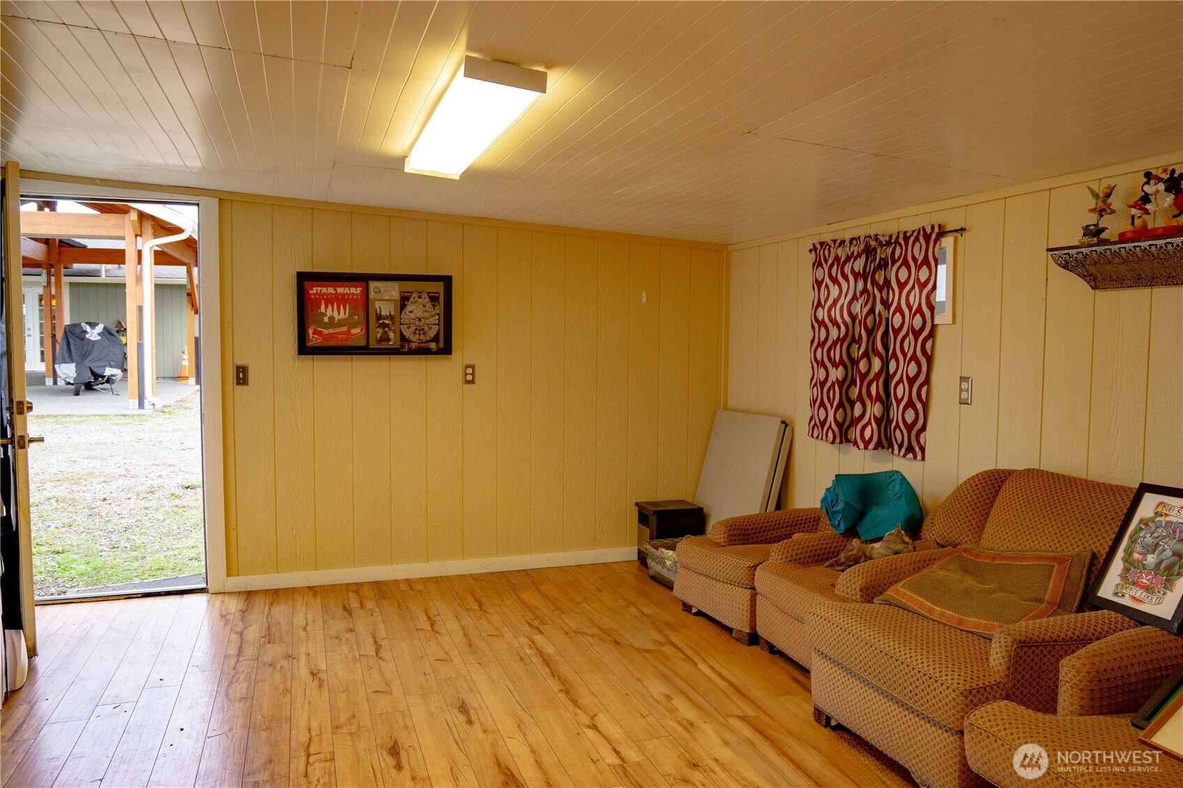 151 Valley View Drive Sequim, WA 98382 - Photo 32 of 40 a living room with couches and painting on the wall