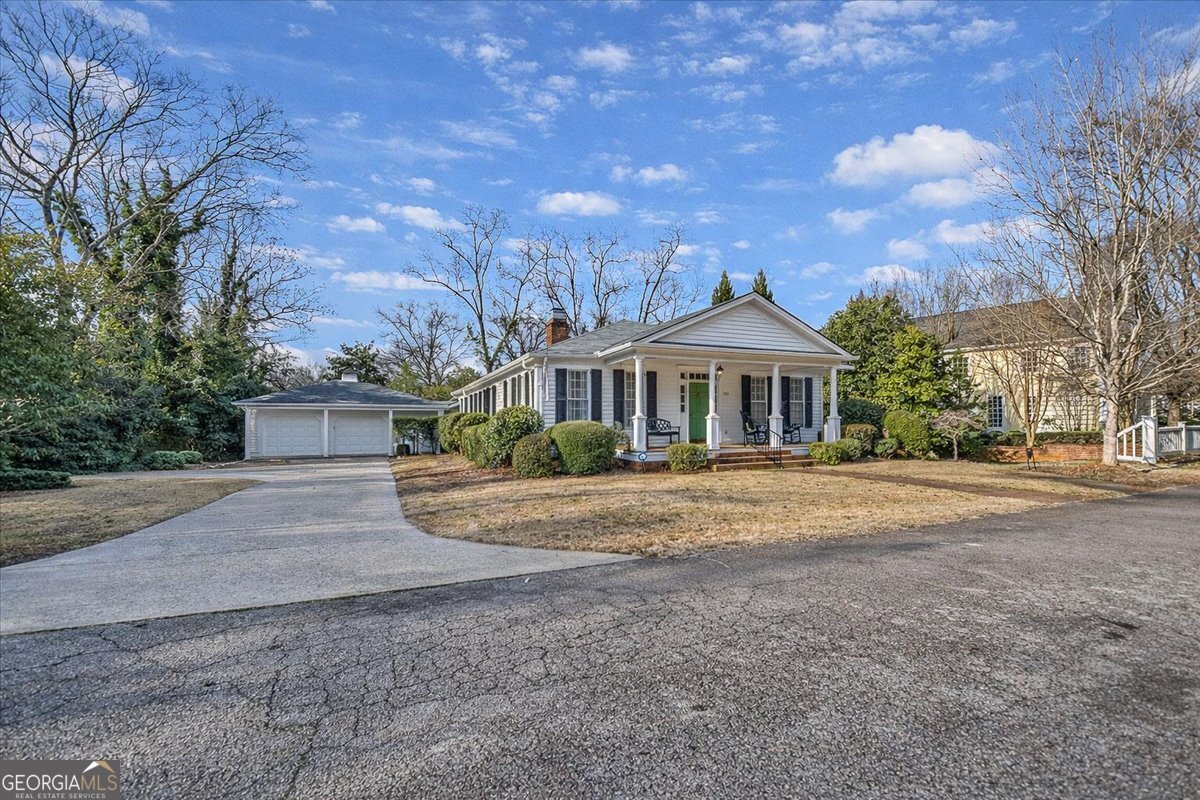 661 East Walton Street Madison, GA 30650 - Photo 34 of 35 a front view of house with yard and trees