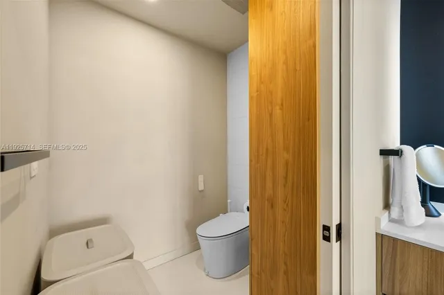 a bathroom with a toilet and a sink