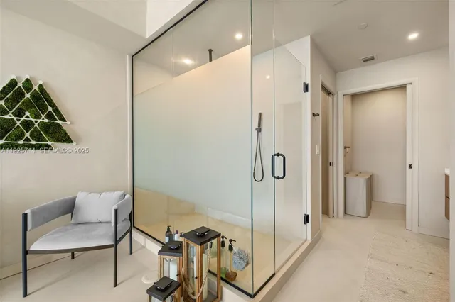 a bathroom with a shower and a toilet